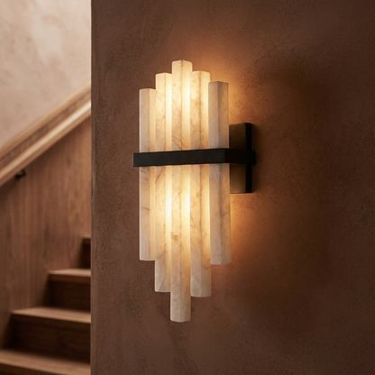 Alabaster cascade wall sconce mounted on a warm wall