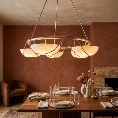 Alabaster ring chandelier over a dining table in a warm interior